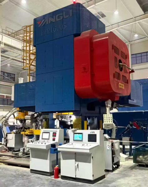 Industrial forging press machine in a manufacturing facility