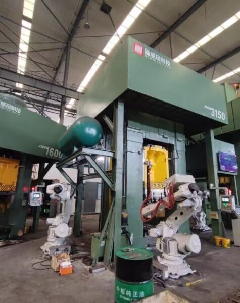 Heavy-duty forging press equipment in an industrial manufacturing plant